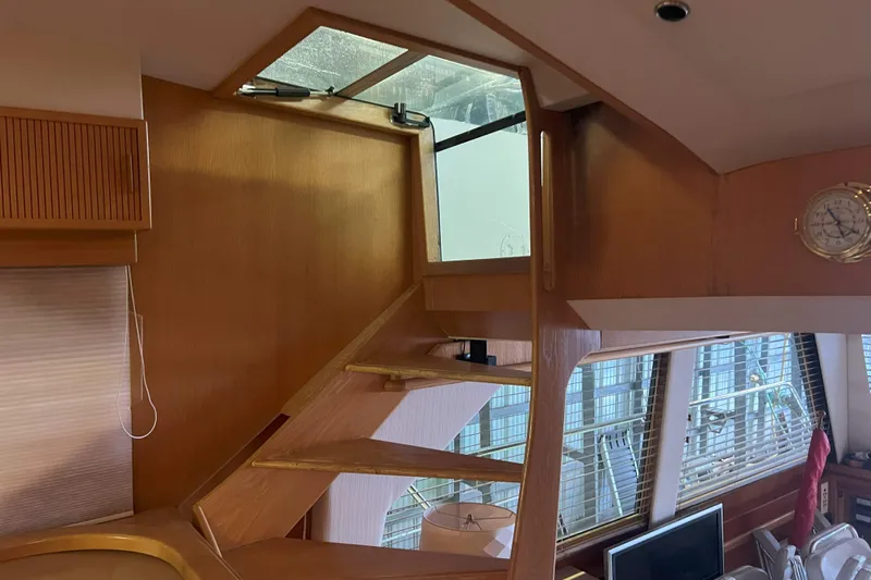 Dream Catcher Yacht Photos Pics Interior of 1998 West Bay 58 yacht with wooden stairs and nautical decor.