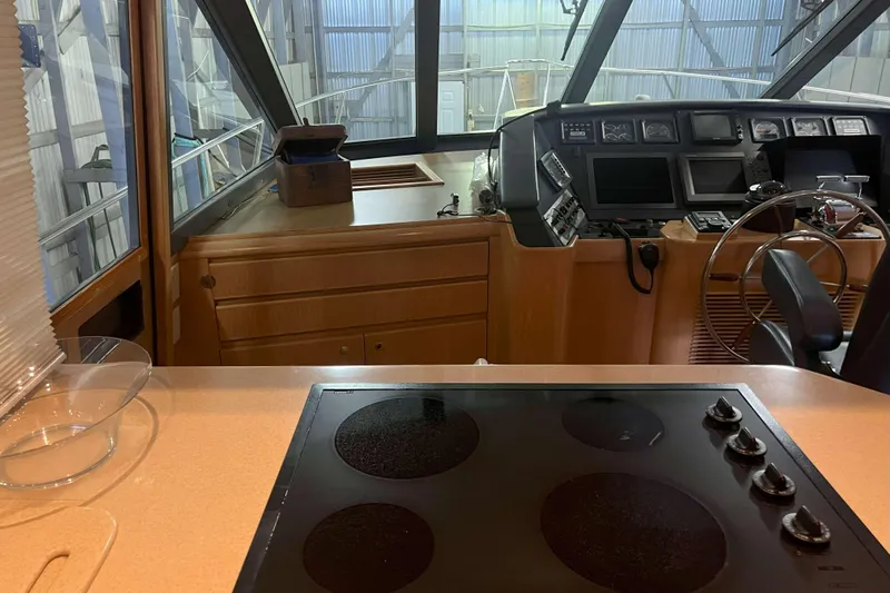 Dream Catcher Yacht Photos Pics Interior of 1998 West Bay 58 yacht with helm and kitchen area.