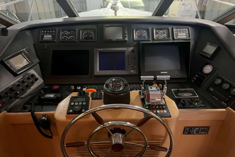 Dream Catcher Yacht Photos Pics Cockpit of 1998 West Bay 58 yacht with navigation instruments and steering wheel.