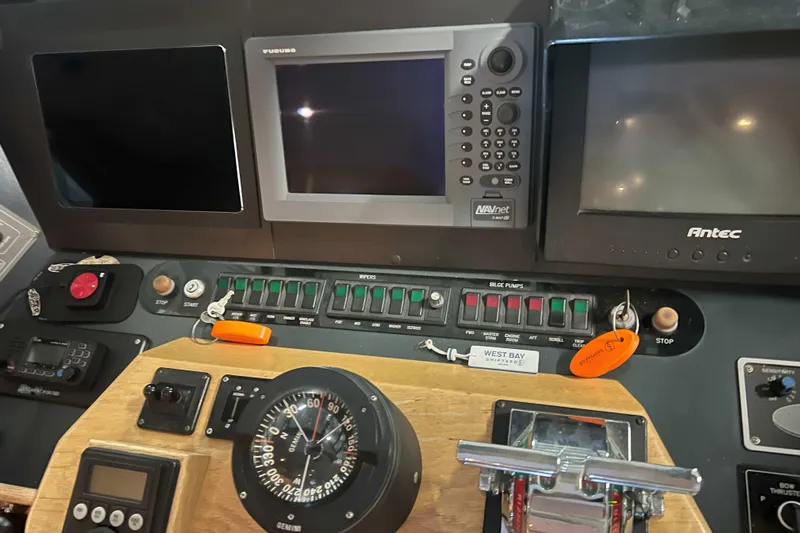 Dream Catcher Yacht Photos Pics Control panel of a 1998 West Bay 58 yacht with navigation and monitoring equipment.