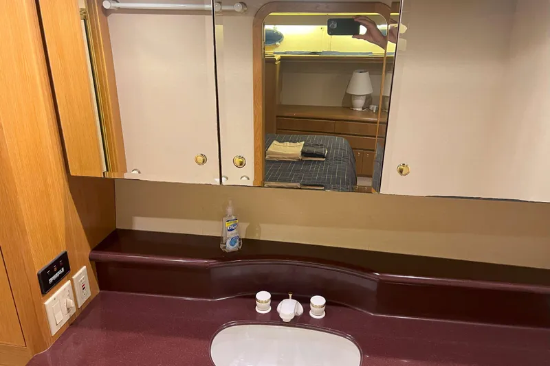 Dream Catcher Yacht Photos Pics Bathroom vanity with mirror and sink in 1998 West Bay 58 yacht.