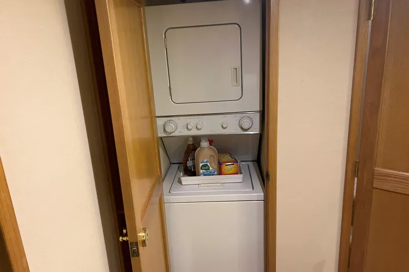 Dream Catcher Yacht Photos Pics Stacked washer and dryer in a 1998 West Bay 58 yacht laundry area.