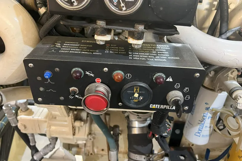 Dream Catcher Yacht Photos Pics Control panel of a 1998 West Bay 58 yacht engine, featuring diagnostic codes and gauges.