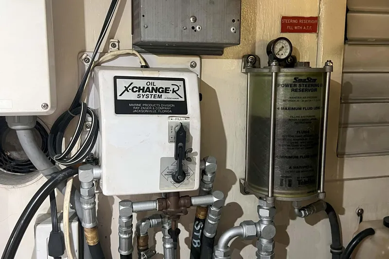 Dream Catcher Yacht Photos Pics Oil X-Changer system and power steering reservoir in 1998 West Bay 58 yacht.