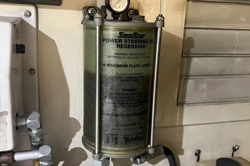 Dream Catcher Yacht Photos Pics Power steering oil reservoir in a 1998 West Bay 58 yacht engine room.