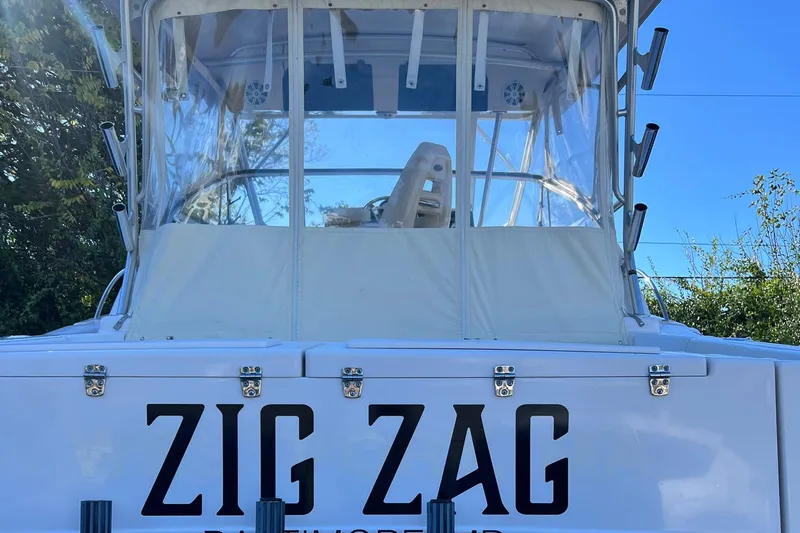 Zig Zag Yacht Photos Pics 2004 Grady-White Express 330 boat named "Zig Zag" with clear enclosure.