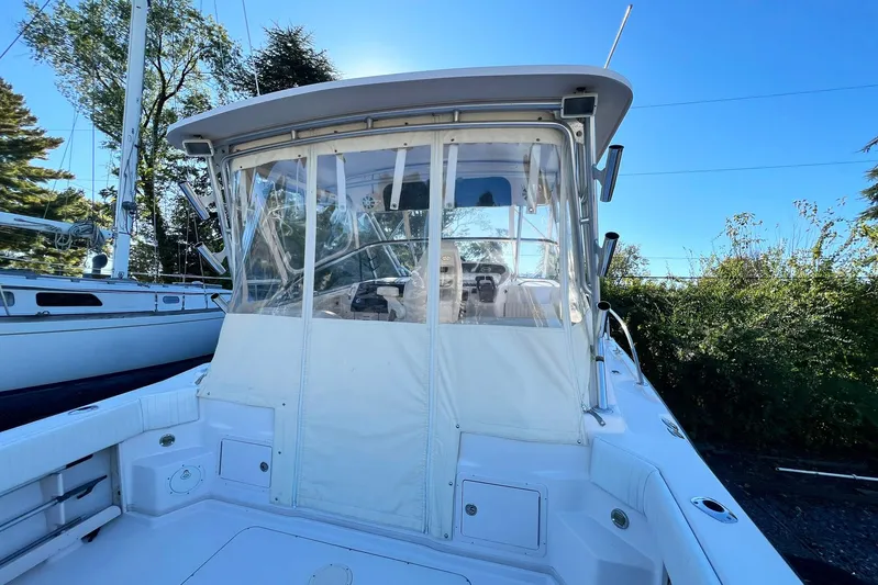 Zig Zag Yacht Photos Pics 2004 Grady-White Express 330 boat with enclosed cockpit, docked outdoors.