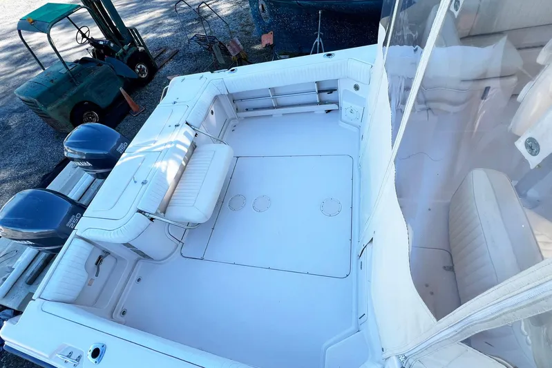 Zig Zag Yacht Photos Pics 2004 Grady-White Express 330 boat interior with seating and dual Yamaha engines.