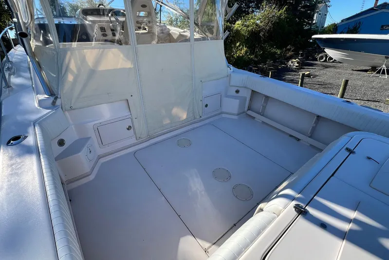 Zig Zag Yacht Photos Pics 2004 Grady-White Express 330 boat deck, spacious and well-maintained, with seating and storage.