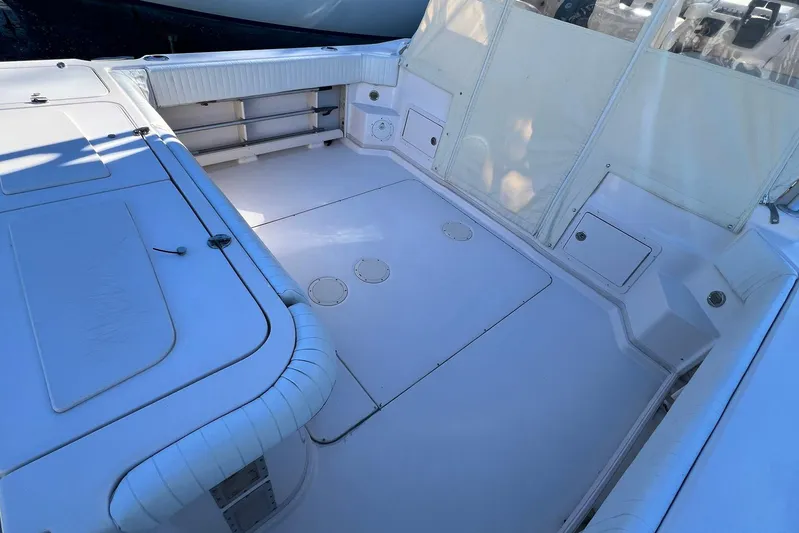 Zig Zag Yacht Photos Pics 2004 Grady-White Express 330 boat deck with white seating and storage compartments.
