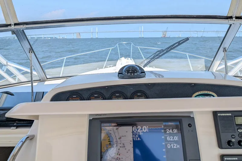 Zig Zag Yacht Photos Pics 2004 Grady-White Express 330 boat dashboard with navigation system, cruising on open water.