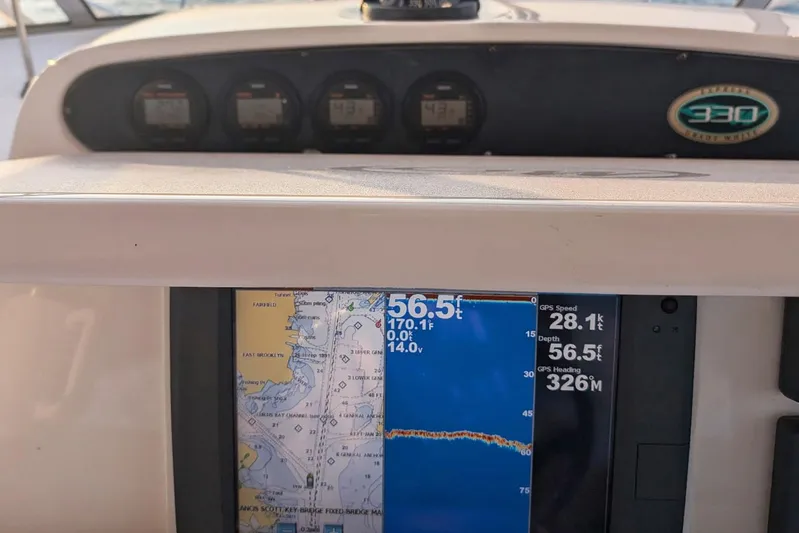 Zig Zag Yacht Photos Pics Dashboard of a 2004 Grady-White Express 330 boat with navigation instruments.