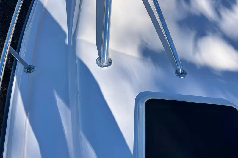 Zig Zag Yacht Photos Pics Close-up of 2004 Grady-White Express 330 boat deck with metal railings.