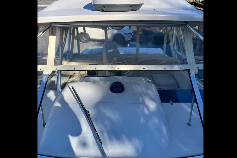 Zig Zag Yacht Photos Pics 2004 Grady-White Express 330 boat with windshield and wiper, parked outdoors.