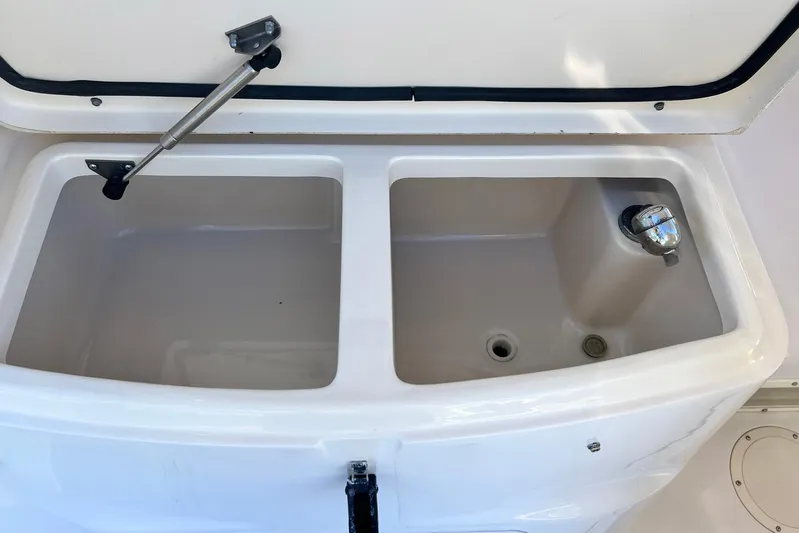 Zig Zag Yacht Photos Pics 2004 Grady-White Express 330 boat storage compartments with open lid.