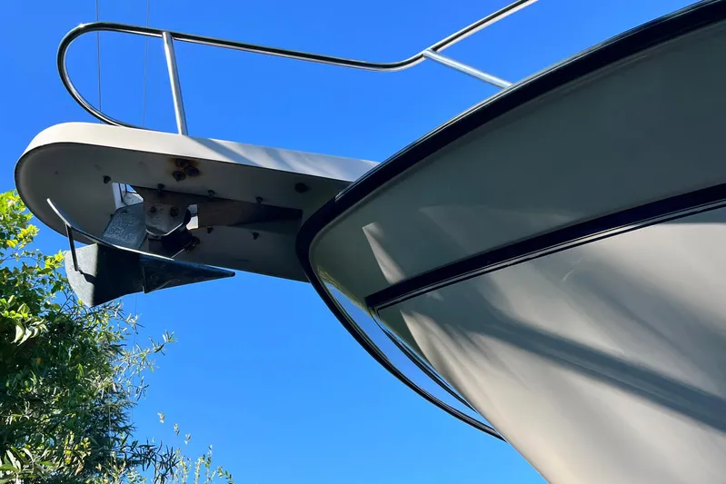 Zig Zag Yacht Photos Pics 2004 Grady-White Express 330 boat bow with anchor against clear blue sky.