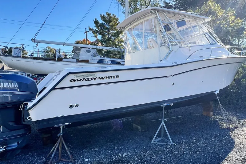 Zig Zag Yacht Photos Pics 2004 Grady-White Express 330 boat on stands, with Yamaha outboard motor.