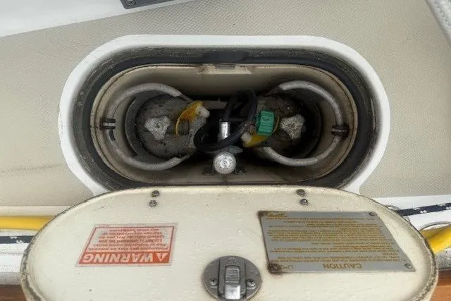 Midnight Yacht Photos Pics 2005 Sabre 386 boat compartment with warning labels and electrical components.