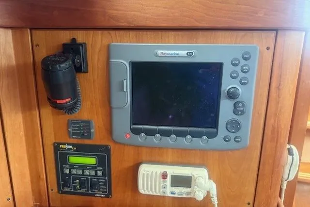 Midnight Yacht Photos Pics Control panel of a 2005 Sabre 386 yacht with navigation and communication equipment.