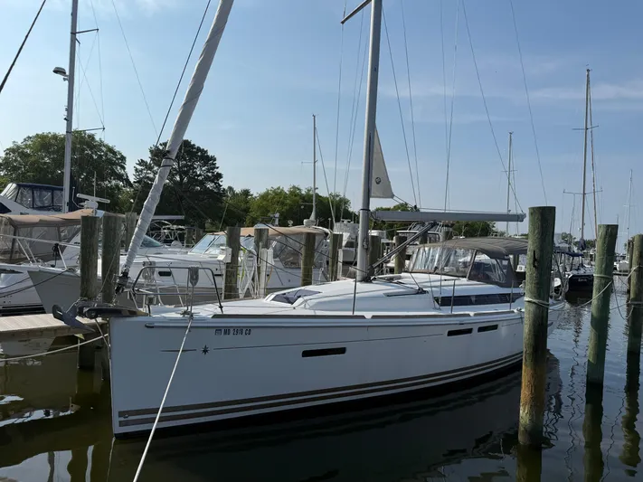 Ma Bro Yacht Photos Pics 2014 Jeanneau Sun Odyssey 409 sailboat docked at a marina.