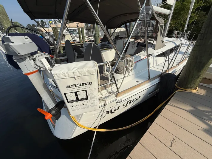 Ma Bro Yacht Photos Pics 2014 Jeanneau Sun Odyssey 409 sailboat docked at marina, rear view.