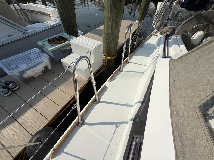 Ma Bro Yacht Photos Pics 2014 Jeanneau Sun Odyssey 409 docked, showing deck and railing details.