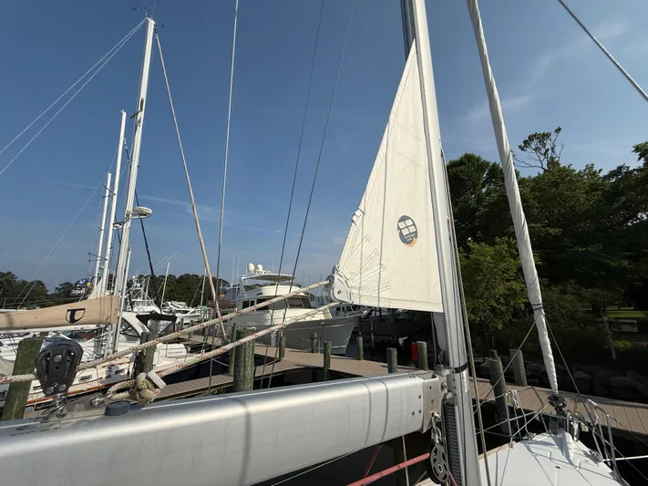 Ma Bro Yacht Photos Pics 2014 Jeanneau Sun Odyssey 409 sailboat docked at marina under clear blue sky.