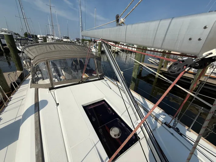 Ma Bro Yacht Photos Pics 2014 Jeanneau Sun Odyssey 409 sailboat docked at marina, showcasing deck and rigging.