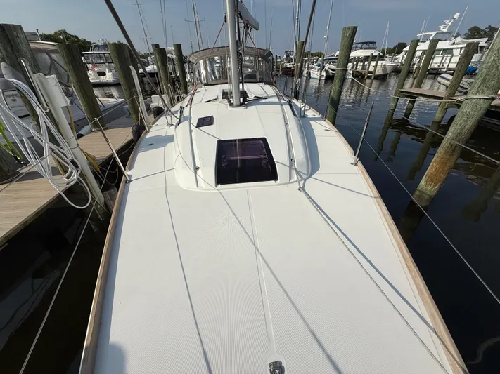 Ma Bro Yacht Photos Pics 2014 Jeanneau Sun Odyssey 409 sailboat docked at marina, showcasing sleek deck design.