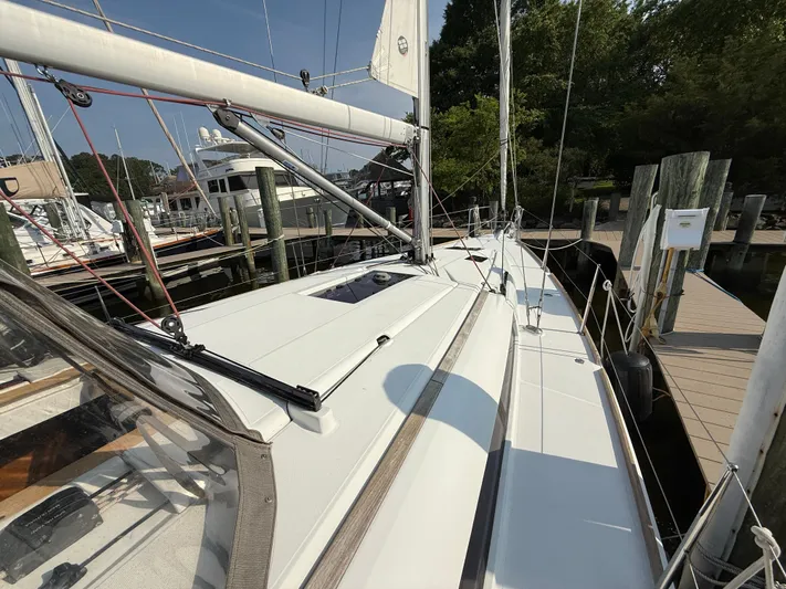 Ma Bro Yacht Photos Pics 2014 Jeanneau Sun Odyssey 409 sailboat docked at marina, showcasing sleek deck design.