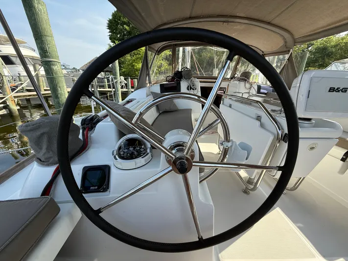 Ma Bro Yacht Photos Pics 2014 Jeanneau Sun Odyssey 409 yacht cockpit with steering wheel and navigation instruments.