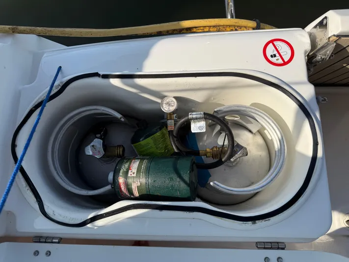 Ma Bro Yacht Photos Pics Storage compartment on 2014 Jeanneau Sun Odyssey 409 with propane tanks and hoses.