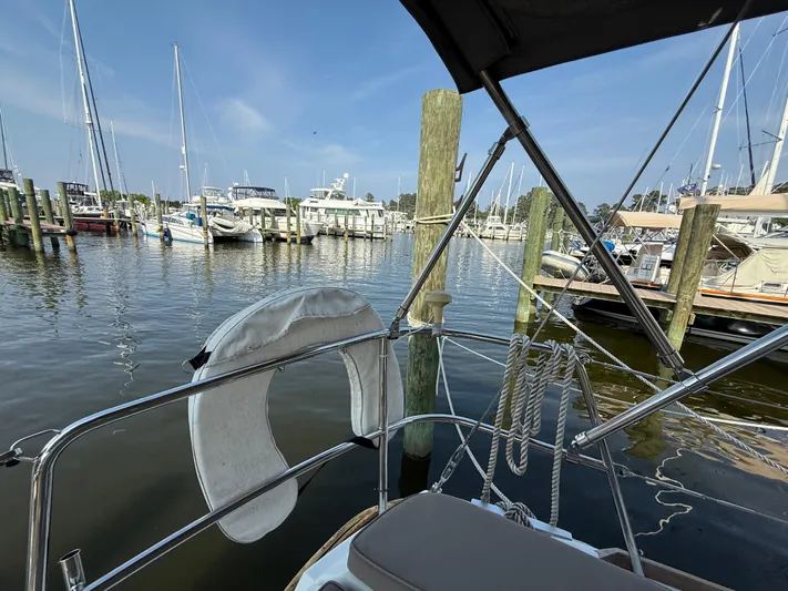 Ma Bro Yacht Photos Pics Jeanneau Sun Odyssey 409 sailboat docked in a marina, 2014 model, with clear blue sky.