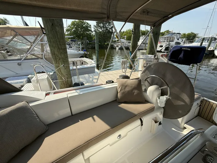 Ma Bro Yacht Photos Pics 2014 Jeanneau Sun Odyssey 409 sailboat interior with cushioned seating at marina.