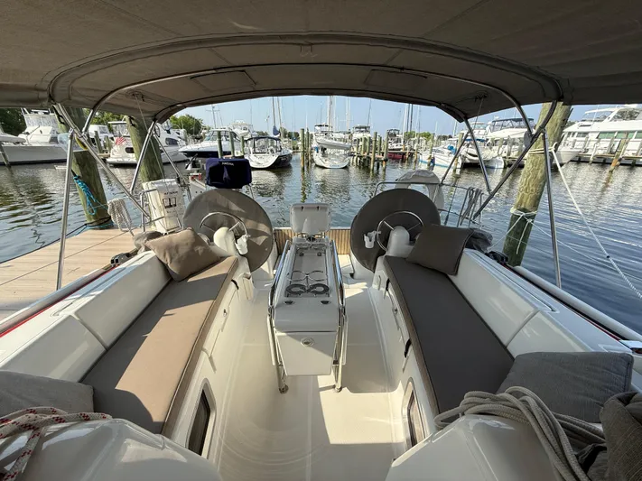 Ma Bro Yacht Photos Pics 2014 Jeanneau Sun Odyssey 409 sailboat cockpit with seating, docked at marina.