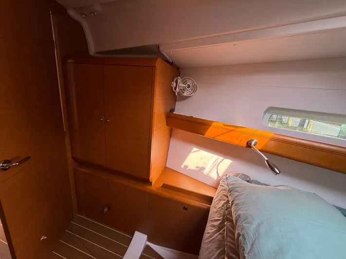 Ma Bro Yacht Photos Pics Cozy cabin interior of 2014 Jeanneau Sun Odyssey 409 sailboat with wooden cabinetry.