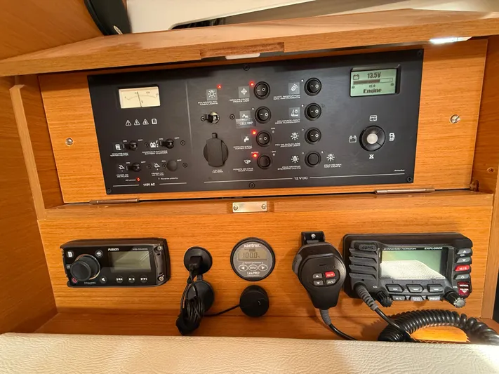 Ma Bro Yacht Photos Pics Control panel of a 2014 Jeanneau Sun Odyssey 409 sailboat, featuring navigation and communication equipment.