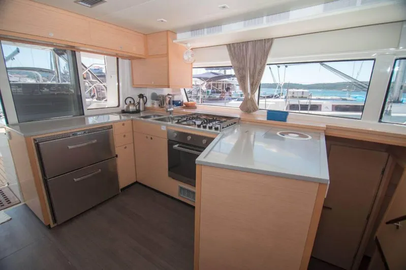 Costabella Yacht Photos Pics Modern kitchen interior on 2018 Lagoon 52 F yacht with ocean view.