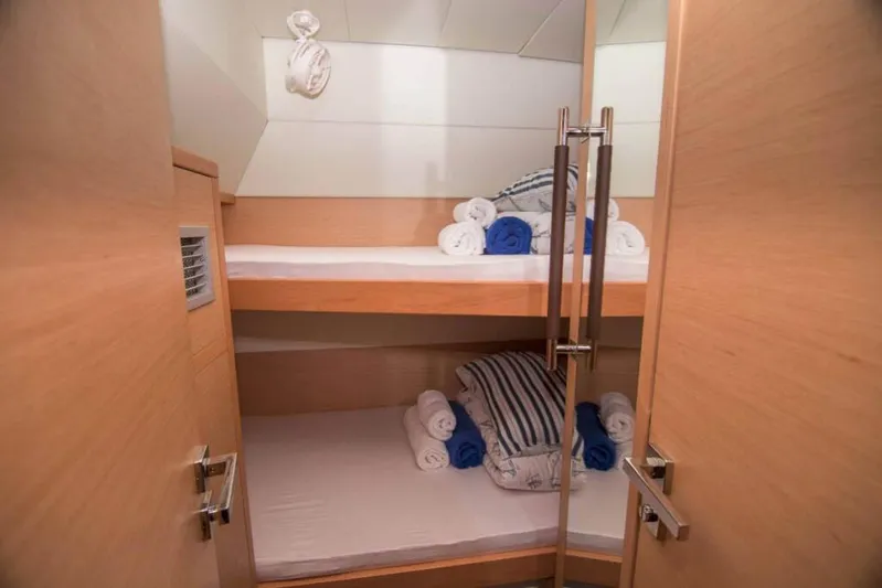 Costabella Yacht Photos Pics Bunk beds in 2018 Lagoon 52 F yacht cabin with neatly arranged towels.