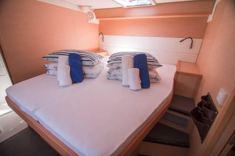 Costabella Yacht Photos Pics Luxurious cabin interior of 2018 Lagoon 52 F yacht with cozy bedding.