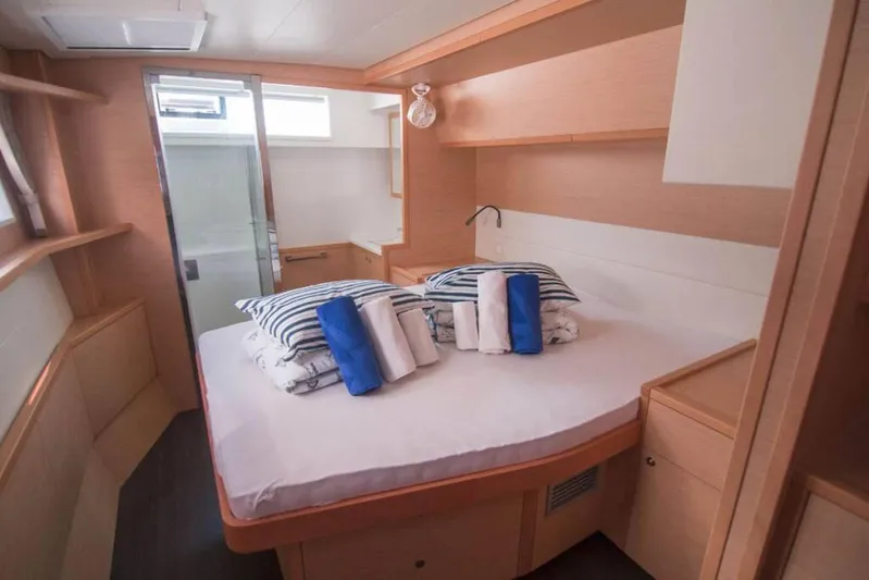 Costabella Yacht Photos Pics Luxurious cabin interior of 2018 Lagoon 52 F yacht with cozy bedding.