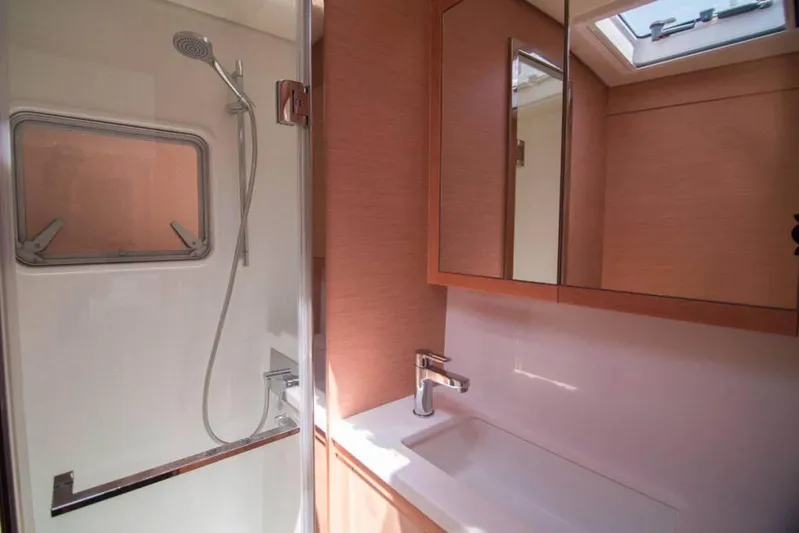 Costabella Yacht Photos Pics Luxurious bathroom in 2018 Lagoon 52 F yacht with modern shower and sink.