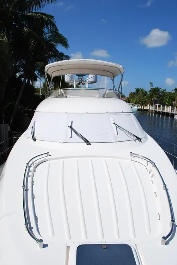 No Name Yacht Photos Pics 2000 Fairline Squadron yacht with sleek design, docked under clear blue sky.