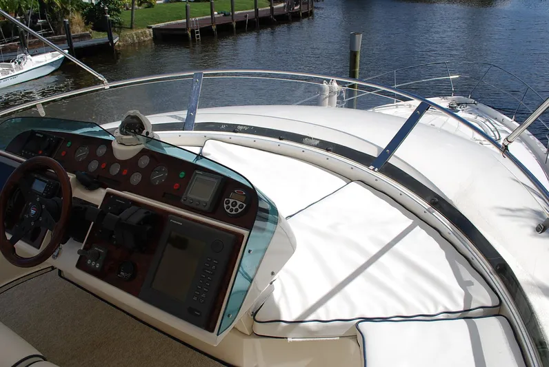 No Name Yacht Photos Pics Cockpit view of 2000 Fairline Squadron yacht with steering wheel and control panel.