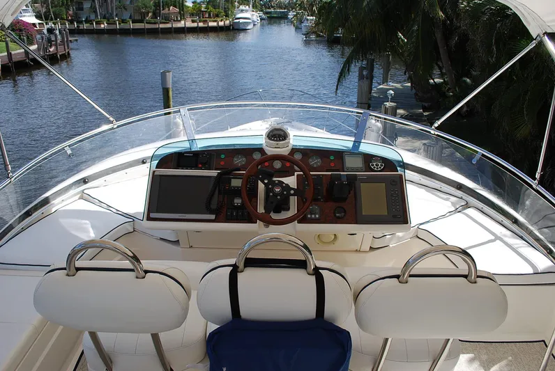 No Name Yacht Photos Pics Helm of 2000 Fairline Squadron yacht with steering wheel and navigation controls.