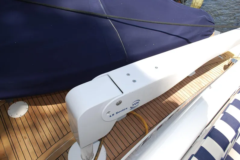 No Name Yacht Photos Pics 2000 Fairline Squadron yacht deck with wooden flooring and covered seating area.