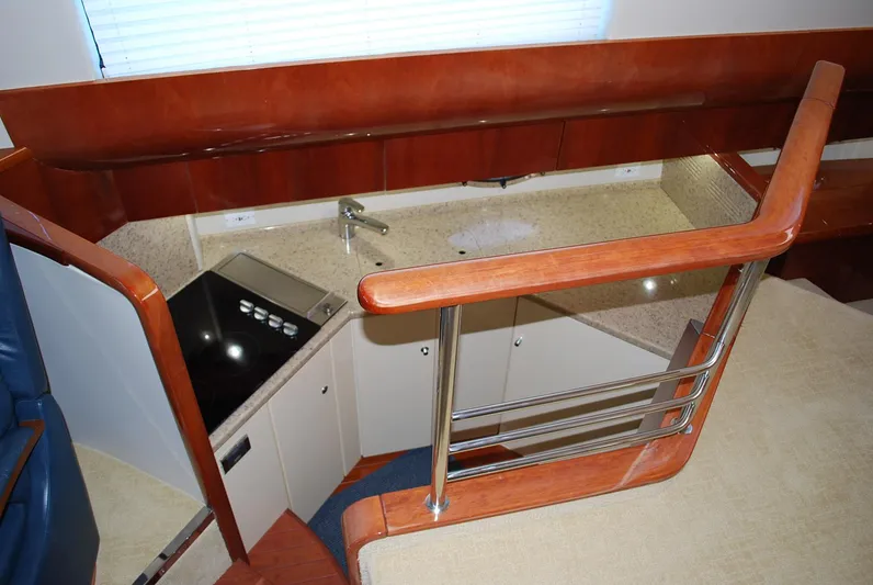 No Name Yacht Photos Pics Interior of 2000 Fairline Squadron yacht, featuring a compact kitchen with modern amenities.