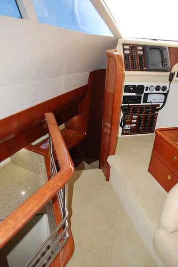 No Name Yacht Photos Pics Interior of 2000 Fairline Squadron yacht with control panel and wooden finishes.
