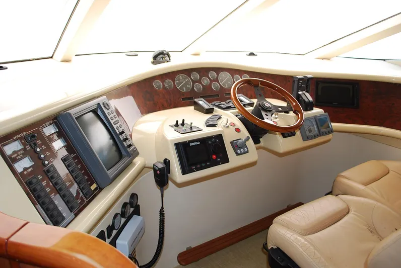 No Name Yacht Photos Pics Helm of 2000 Fairline Squadron yacht with navigation instruments and leather seating.