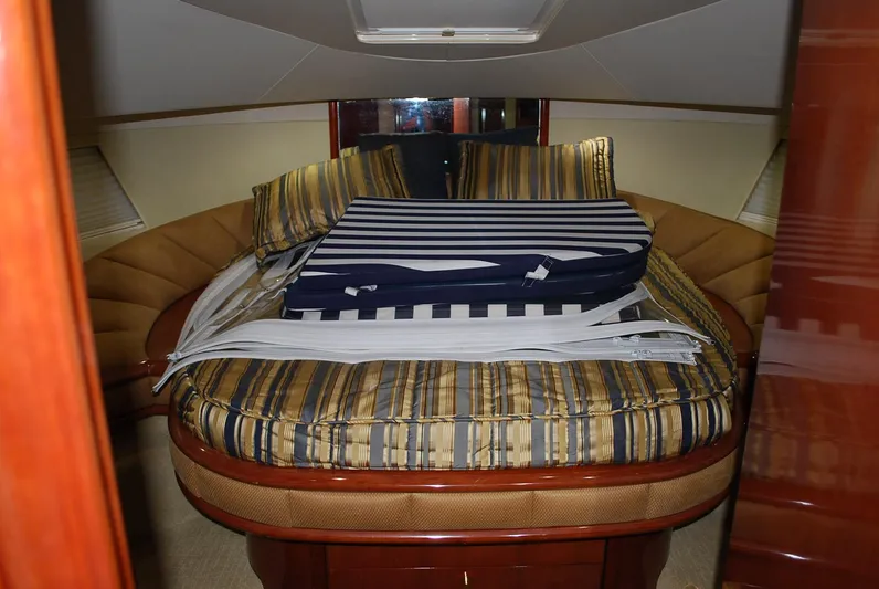 No Name Yacht Photos Pics Luxurious cabin interior of 2000 Fairline Squadron yacht with striped bedding.